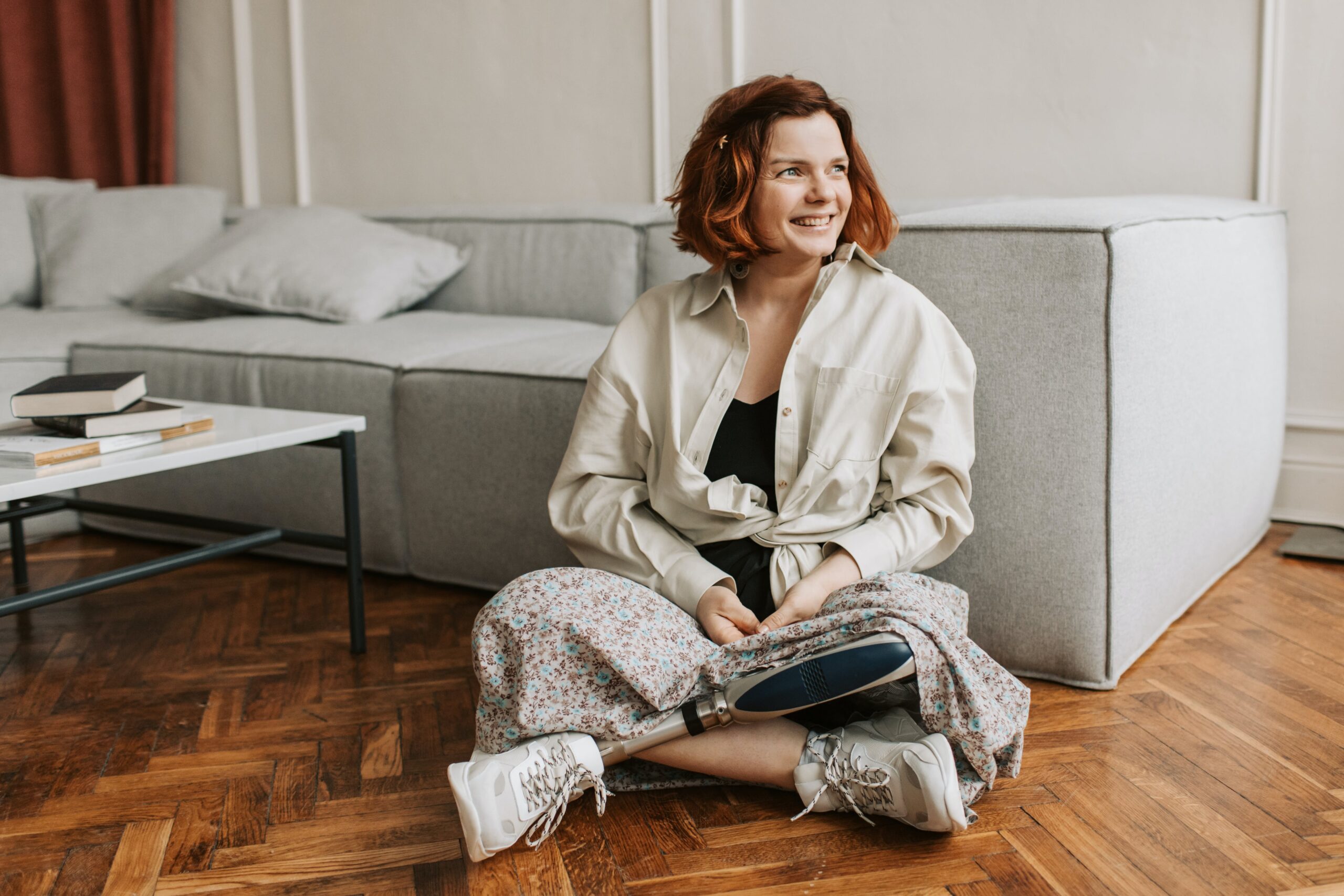 A woman with a mobility aid, smiling