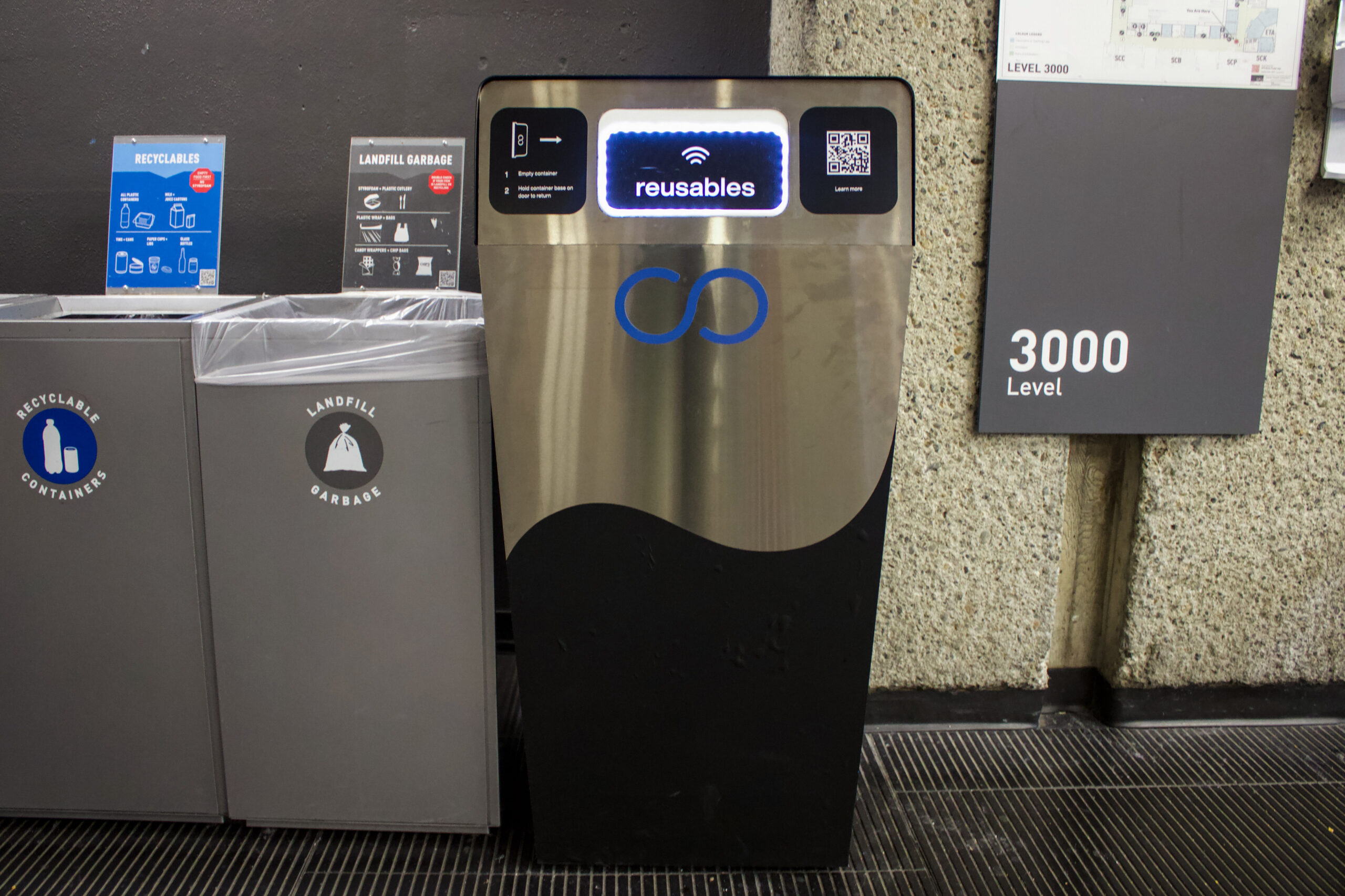 This is a photo of the Reusables container return bin, found in Mackenzie Cafe on SFU Burnaby Mountain.