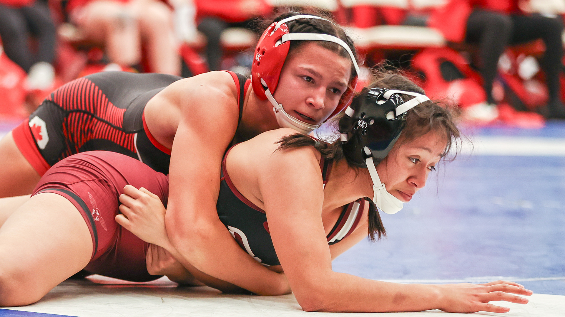 SFU women’s wrestler Victoria Seal with the upper hand against her opponent.