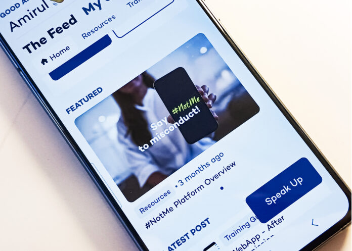 This is a photo of the user interface for the hashtag not me app. The interface shows featured resources and a button that reads “speak up”