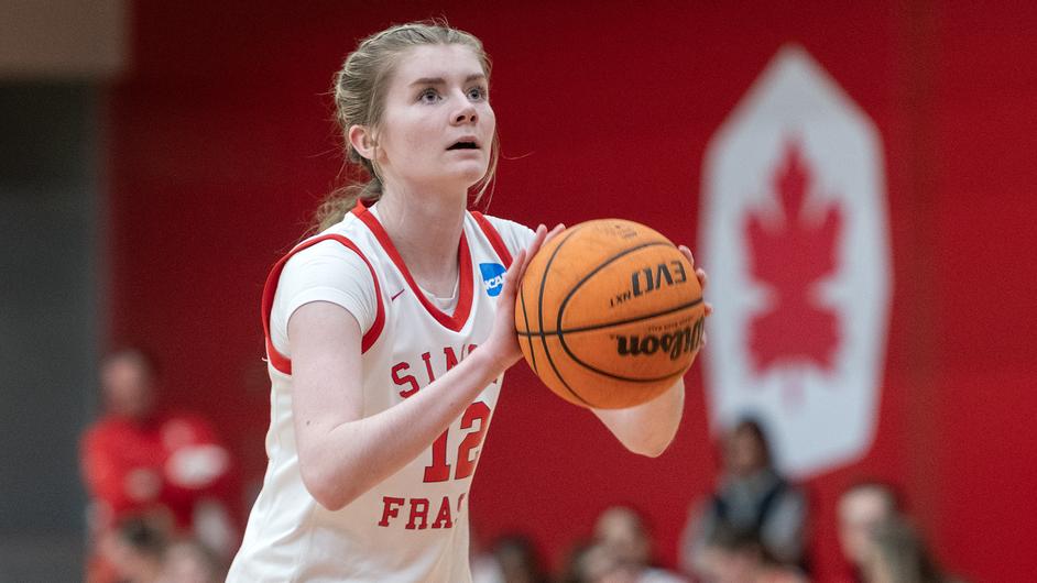 SFU basketball player Rachel Loukes preparing to shoot at the free-throw line.