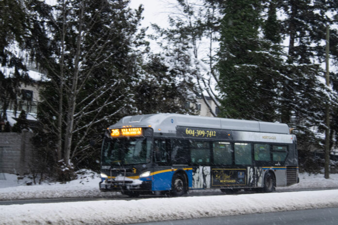 transit-job-action-bus This is a photo of a bus driving down the road.