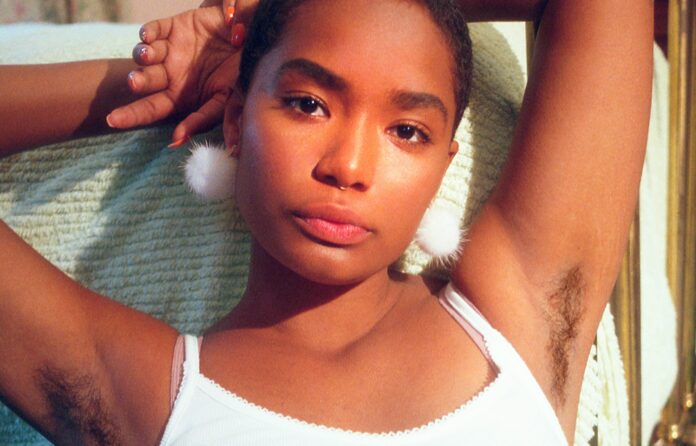 A woman with grown out armpit hair