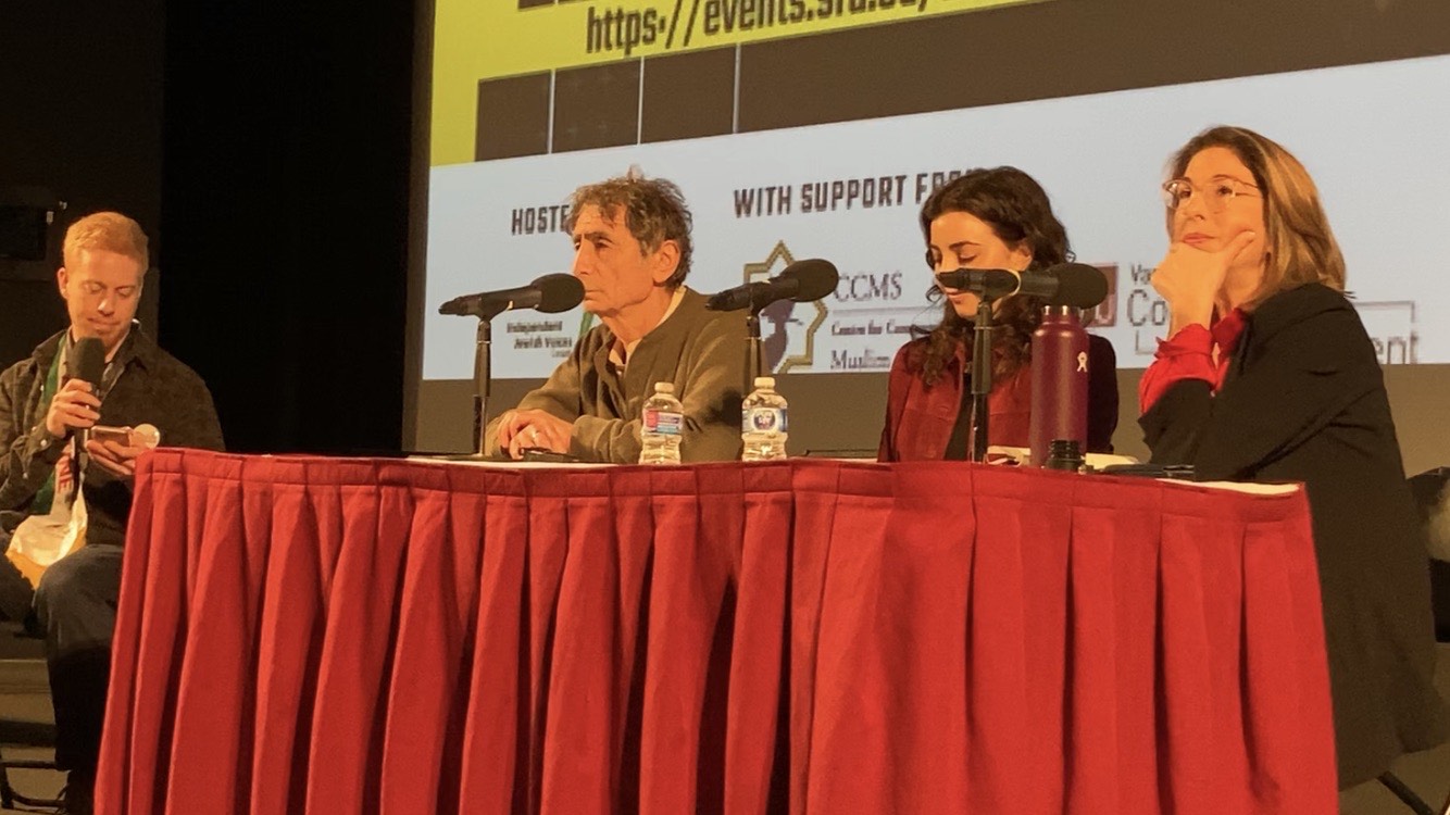 Photo of, from left to right, Dr. Gabor Maté, Simone Zimmerman, and Naomi Klein sat at a panel table.