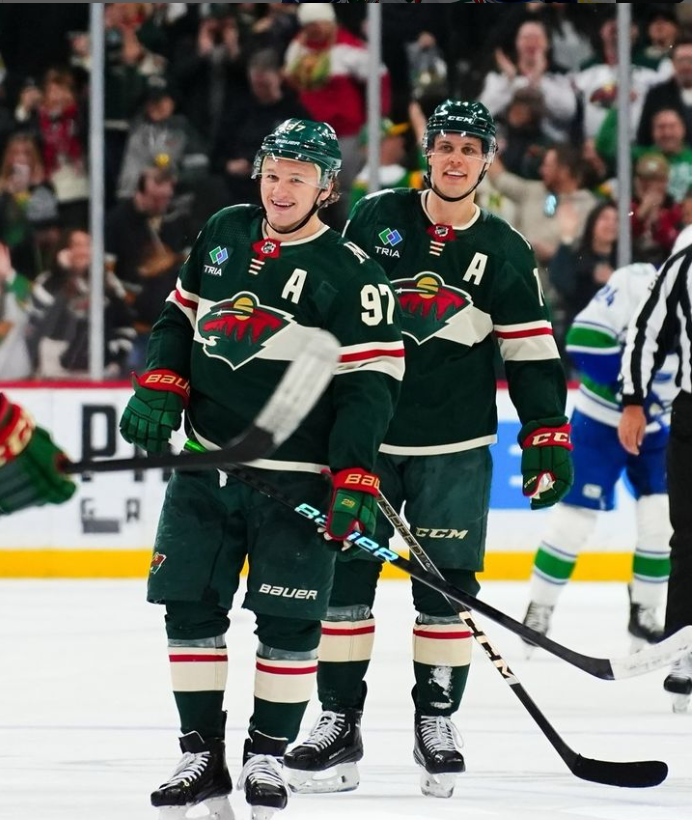 Minnesota Wild’s hat trick scorers Joel Eriksson Ek and Kirill Kaprizov smiling after the hockey game.