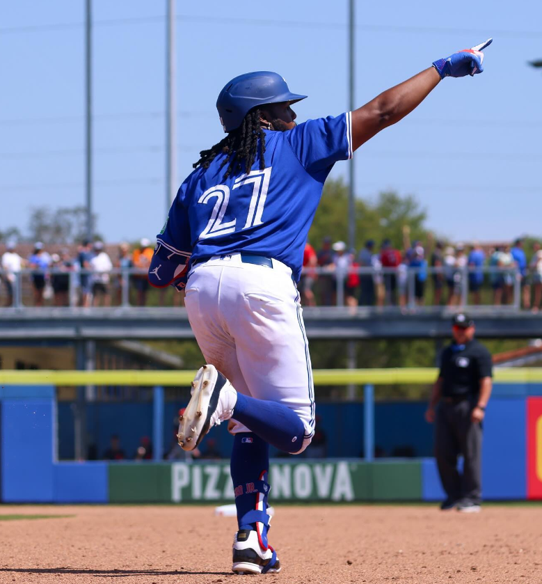 Photo of Vladimir Guerrero Jr. celebrating as he rounds the bases during preseason competition.