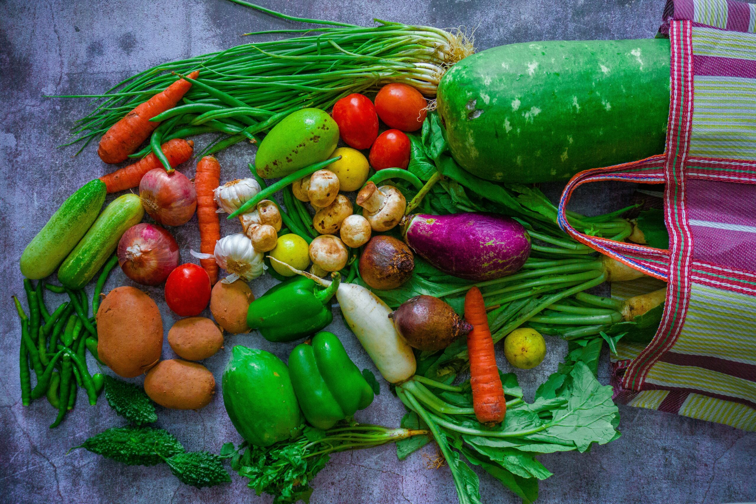 This is a photo of an assortment of vegetables on a table.