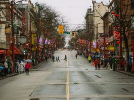 a street in Vancouver’s Chinatown decked out in red paper lanterns and street lights.