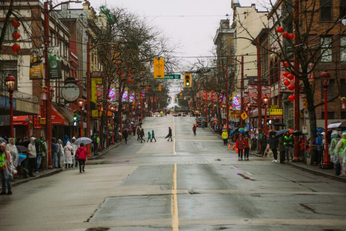 albert-stoynov--unsplash a street in Vancouver’s Chinatown decked out in red paper lanterns and street lights.