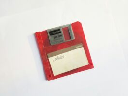 a red floppy disk with a white label near the middle