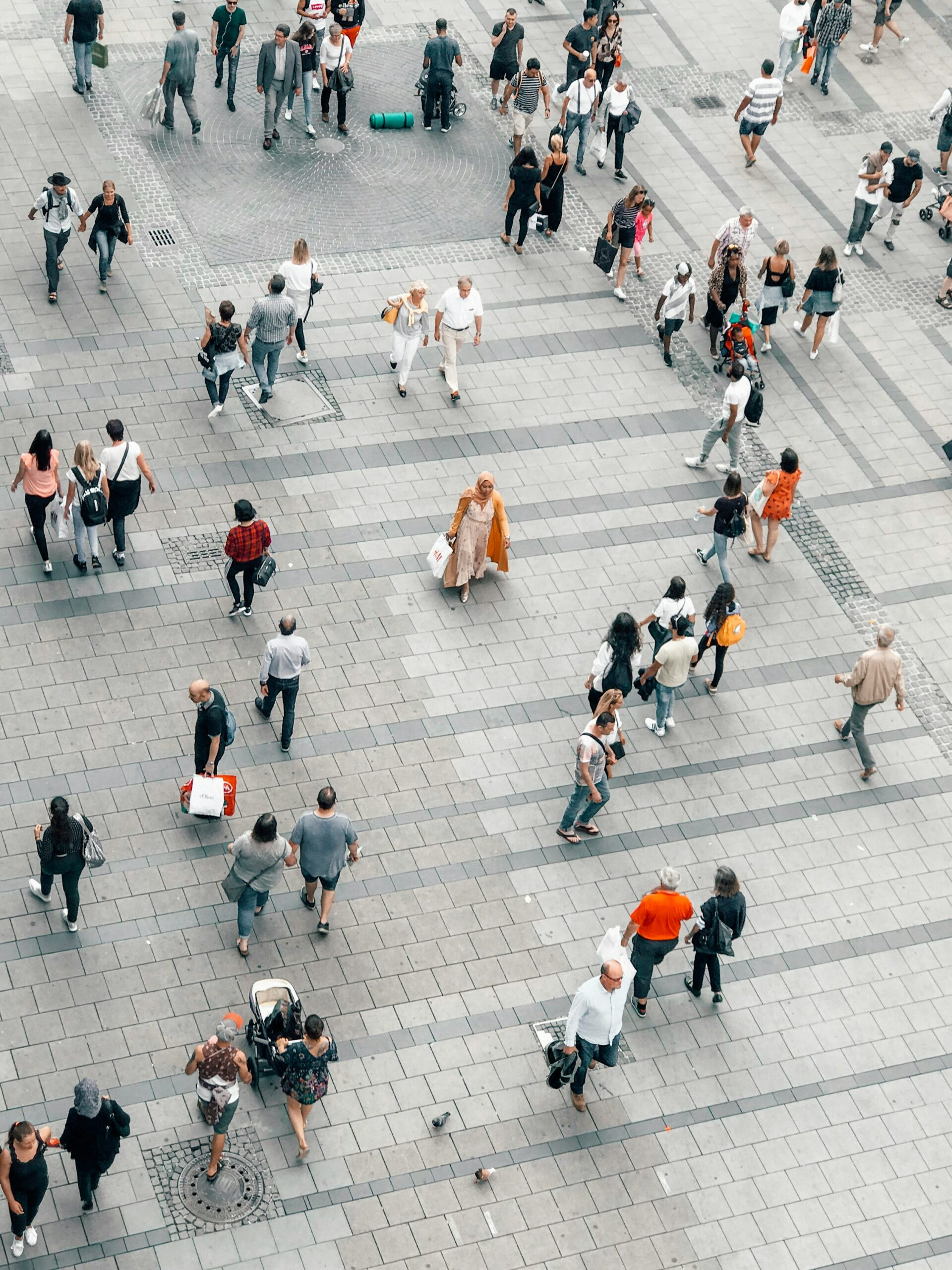 People walking on gray concrete road