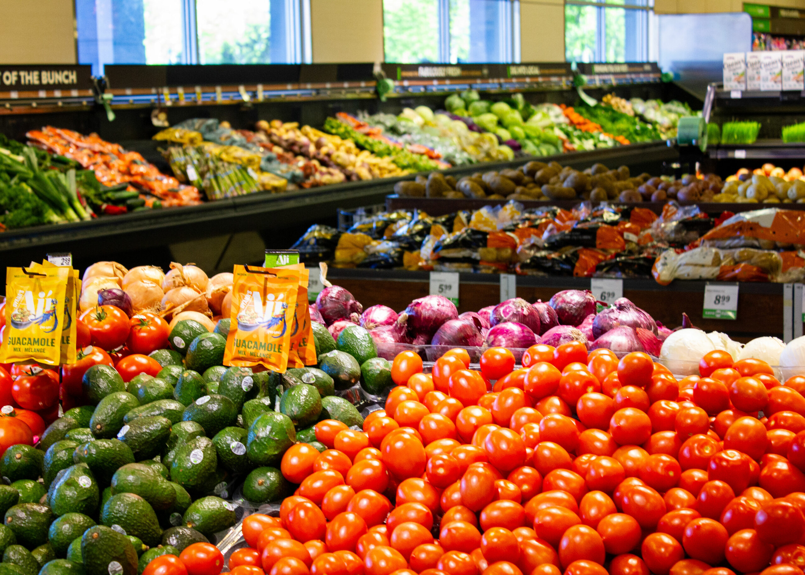 produce stand in a grocery store isle