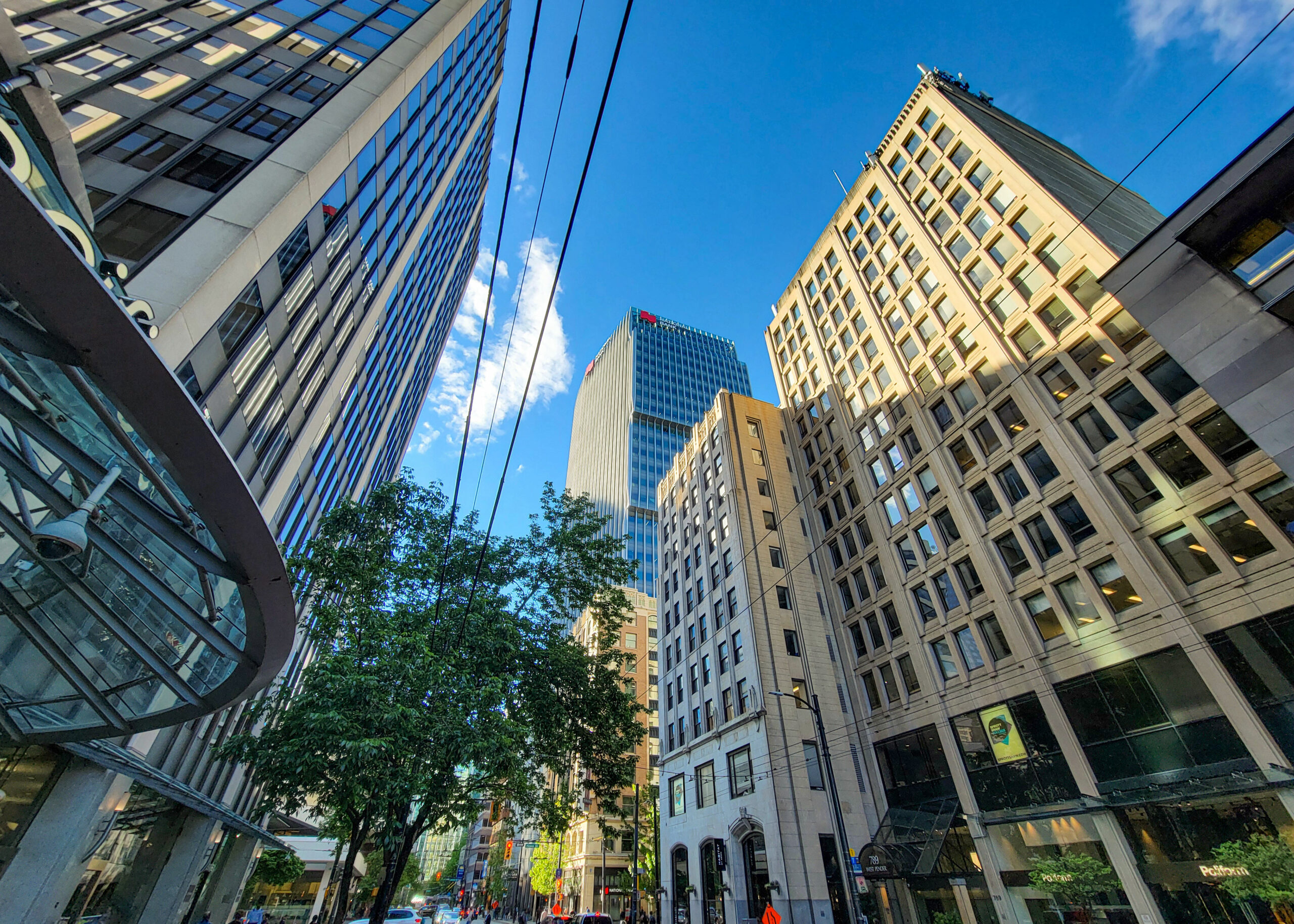 Skyscrapers on a Downtown Vancouver street as seen from below.