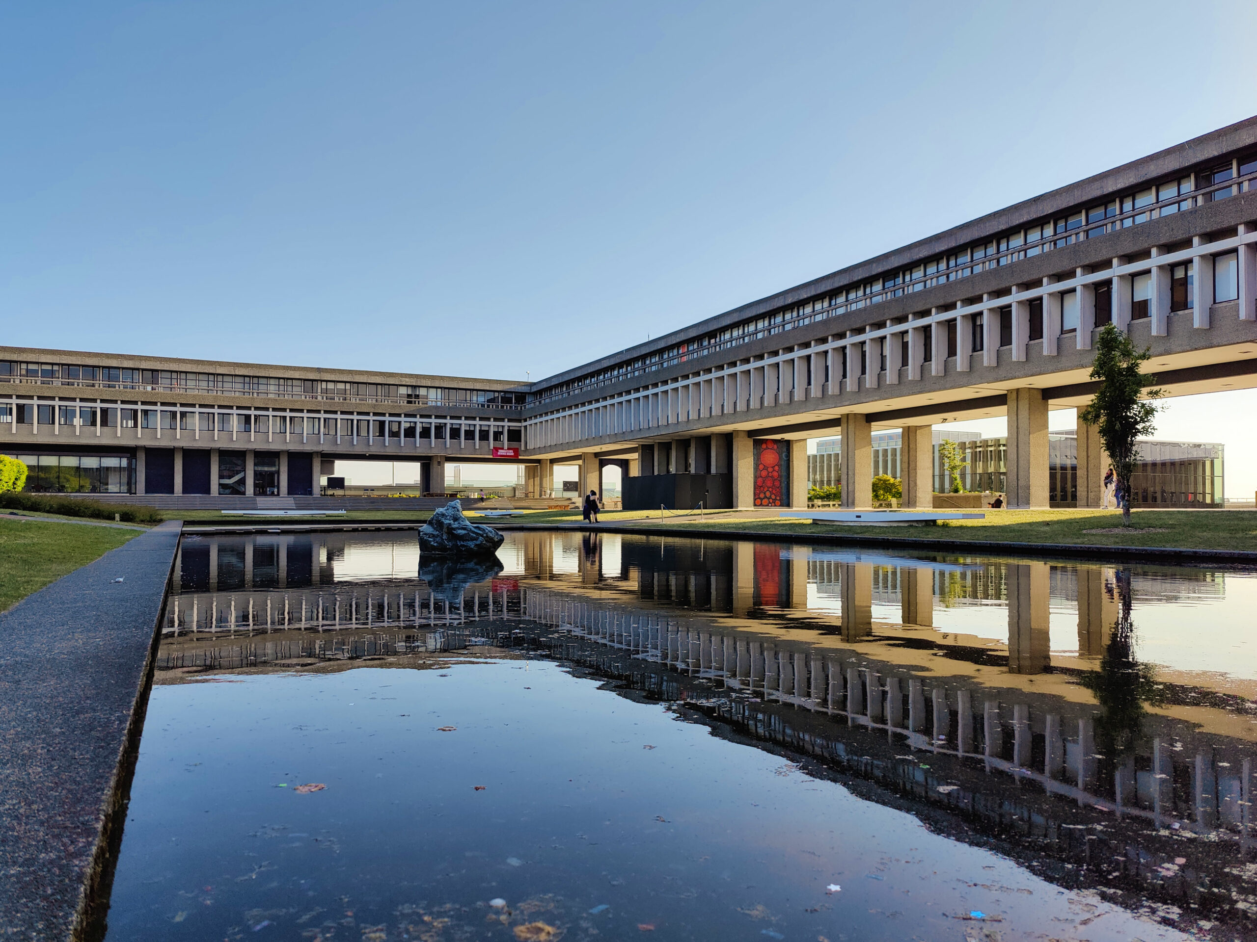 This is a photo of the SFU Burnaby Campus over the reflection pond.