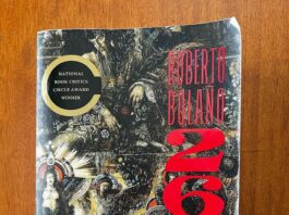 The cover of Bolaño’s 2666 (written on the cover in red), which features a renaissance-styled painting of a woman surrounded by faded hands and faces.