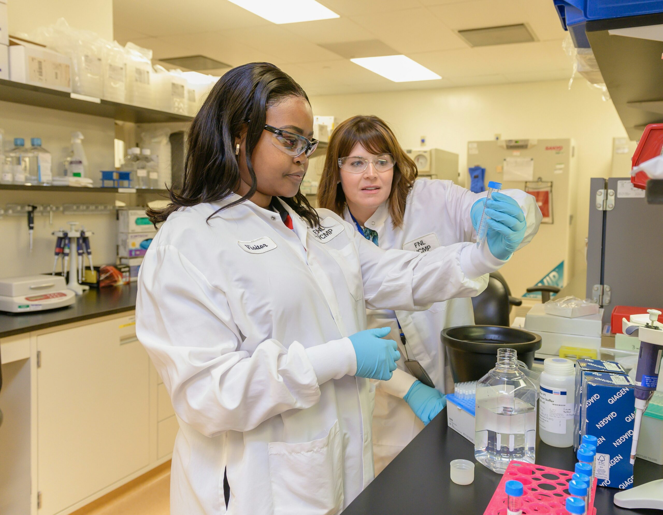 This is a photo of two women in a science lab working together