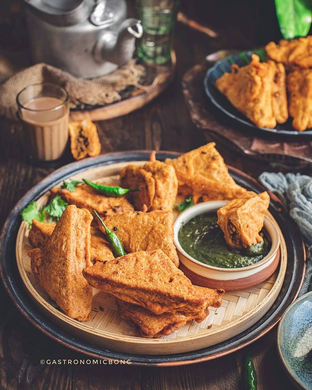 Triangular bread pieces coated in a thick, golden-brown batter.