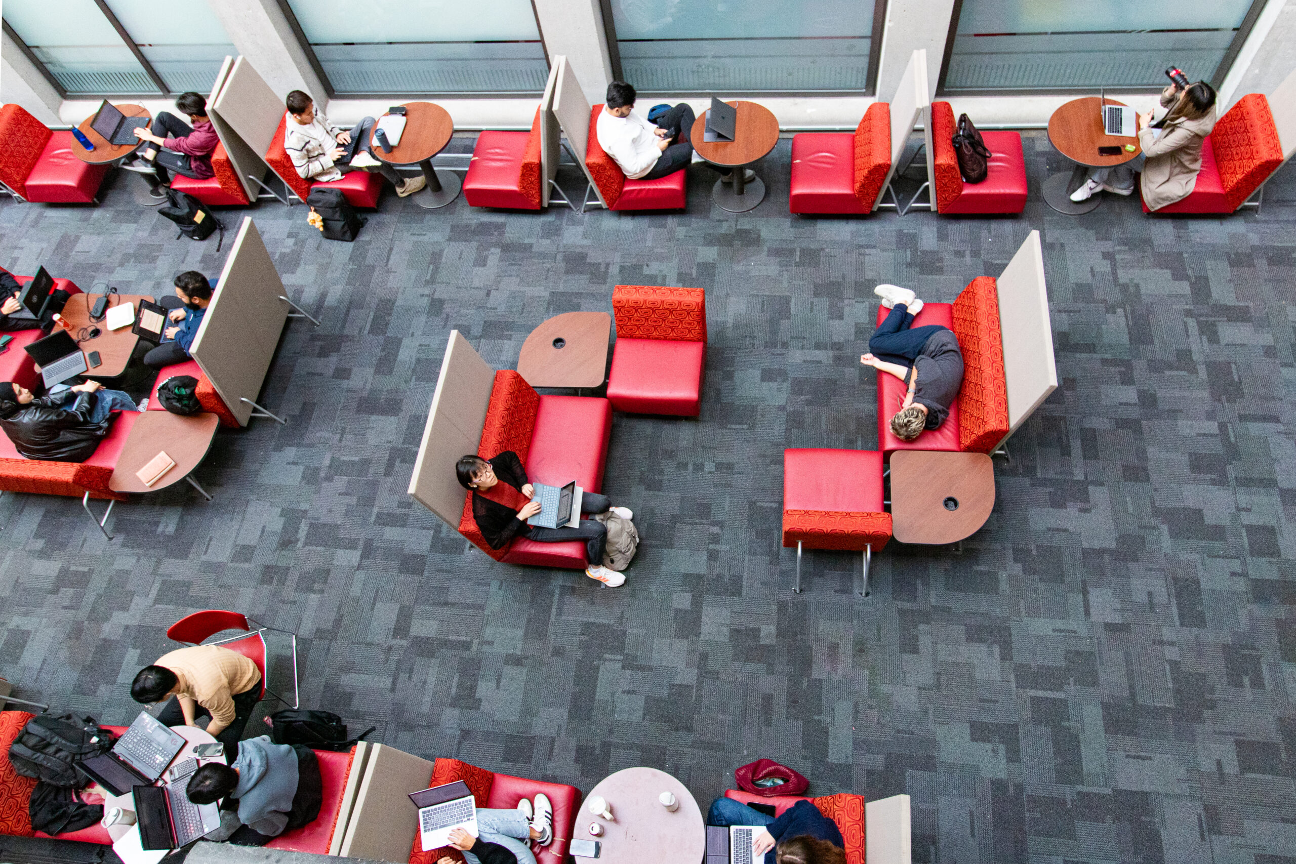 This is a photo of an SFU student in West Mall Centre pretending to be sleeping for the photo.