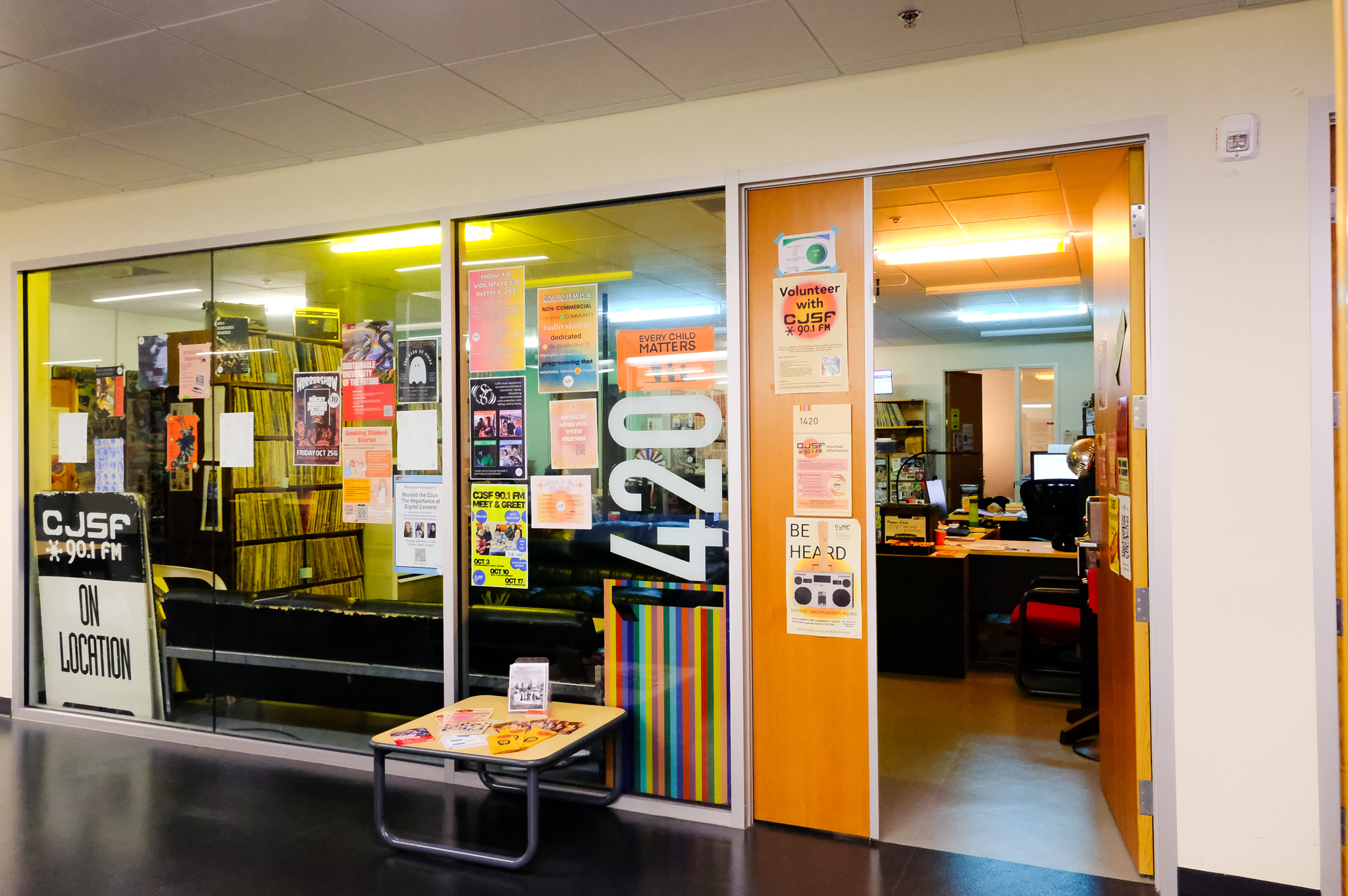 A photo of the CJSF station. Multiple posters and decorations are visible.