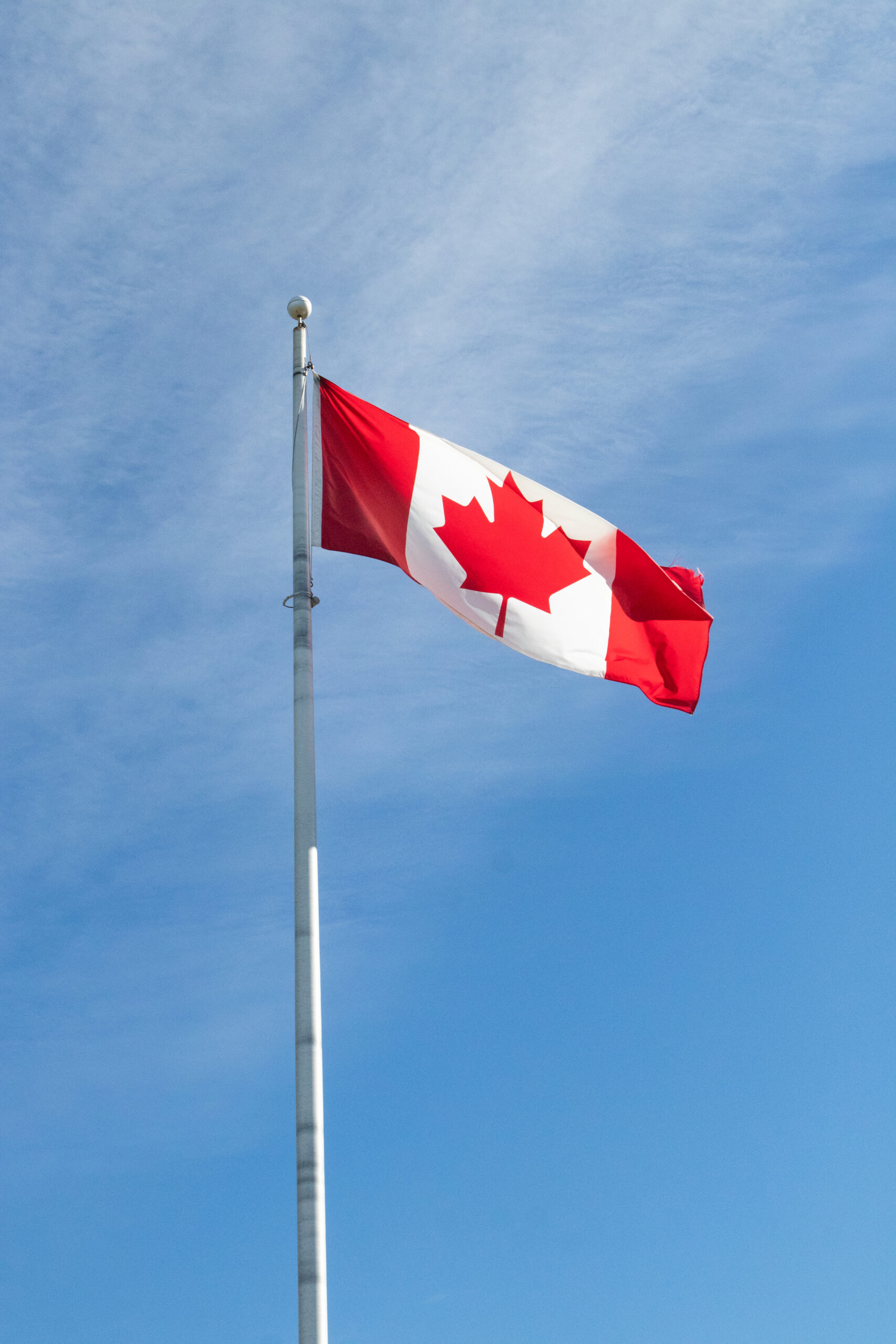 A large Canada flag on a flagpole