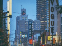 A TransLink bus driving down Vancouver’s Granville strip in the rain