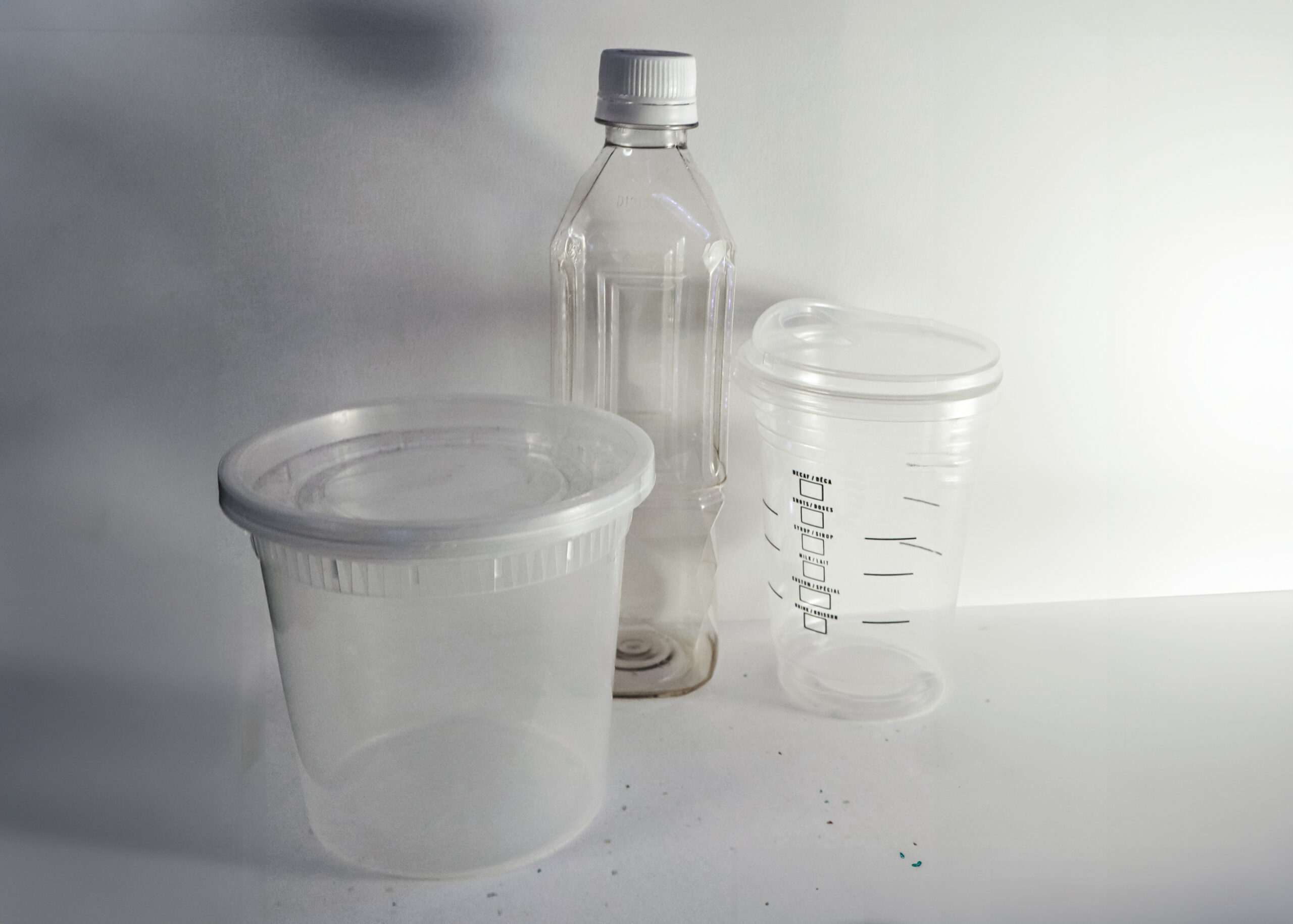 Plastic containers and bottles on a desk