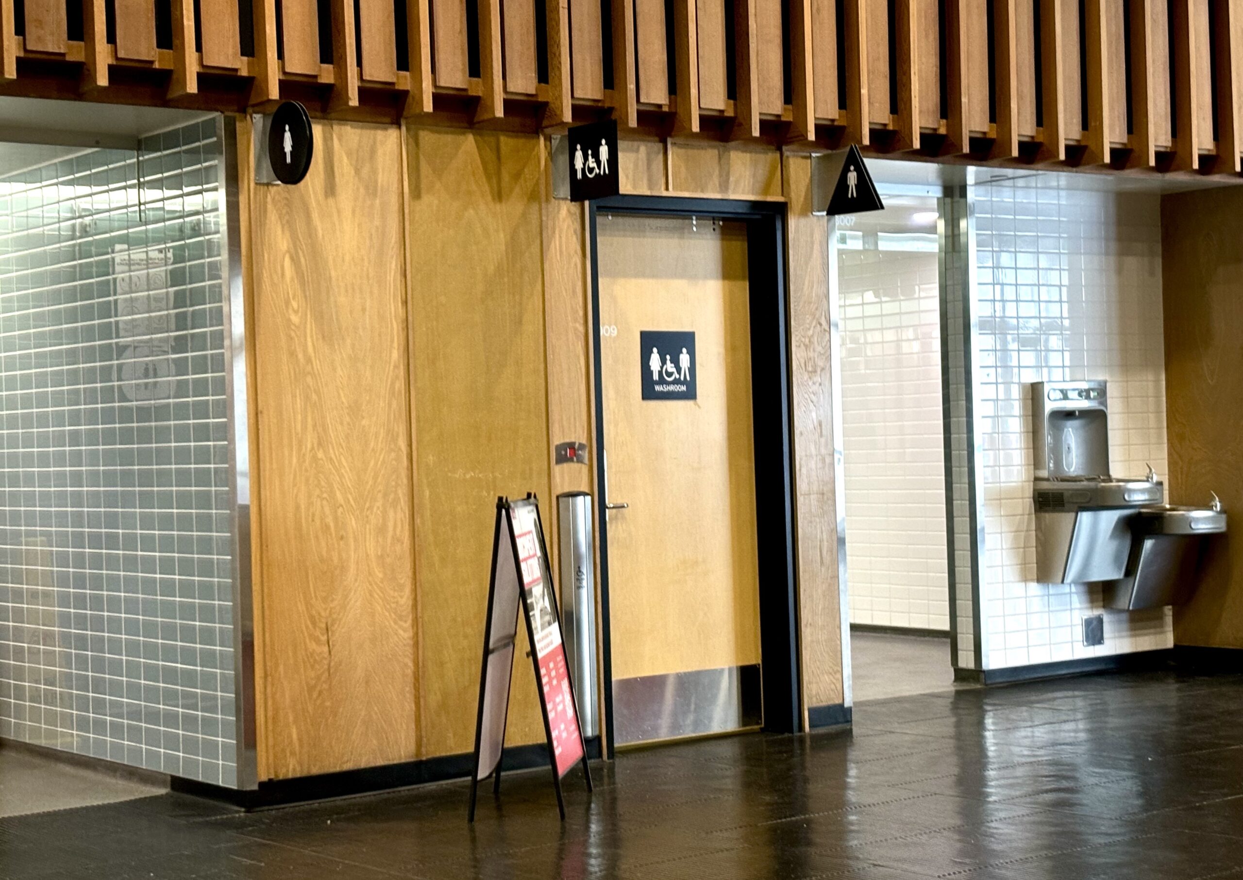 The outside of a single-person washroom in SFU’s academic quadrangle