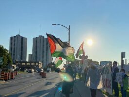 This is a photo of a group of people from Independent Jewish Voices protesting for Palestine.