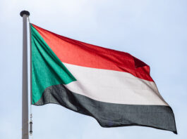 This is a photo of a Sudan flag in the sky.