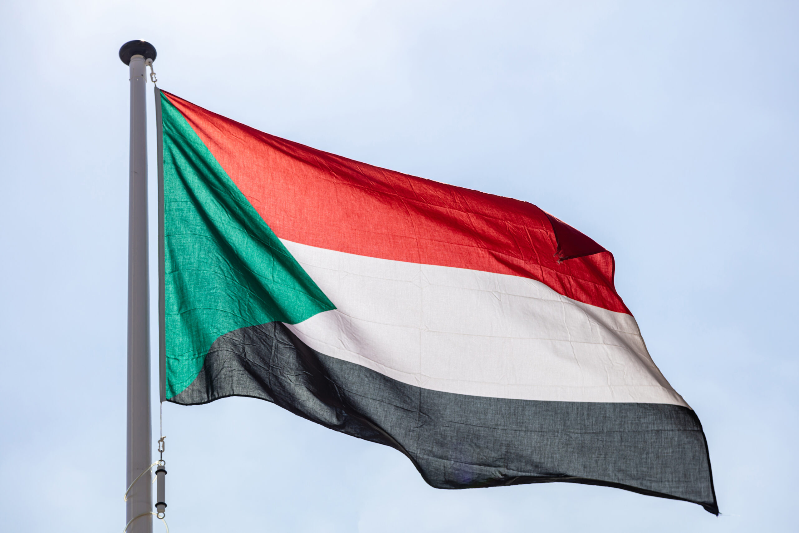 This is a photo of a Sudan flag in the sky.