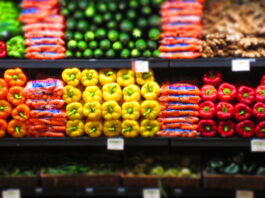 Sliced oranges, broccoli, and nuts displayed in an appealing way.