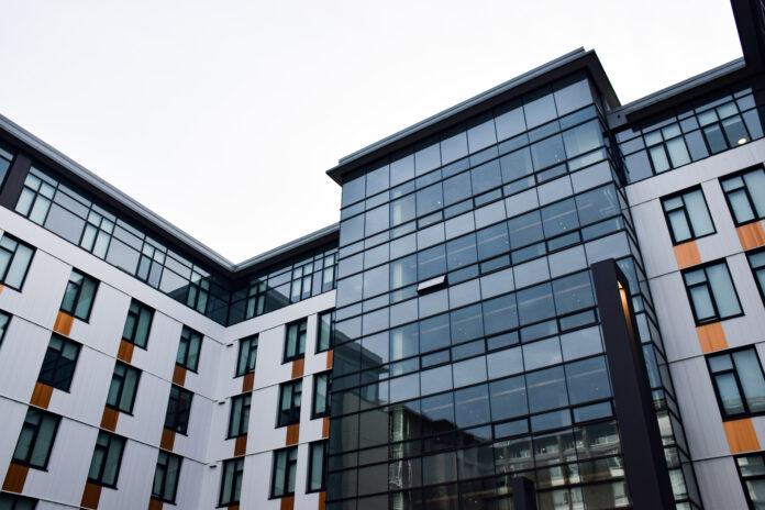 This is a photo of the exterior of an SFU residences building, with the picture taken from the ground.