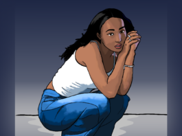 A girl dressed in a white tanktop and blue jeans crouches with her head leaning against both of her arms.