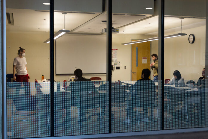 This is a photo of several students in an SFU classroom working at their desks in a U shape. The featured photo does not relate to the incident described in the article.