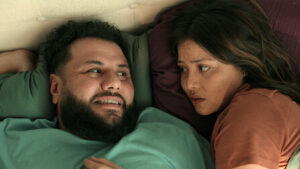 close up shot of a couple  lying in bed