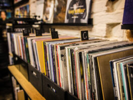 stack of vinyl at a record store