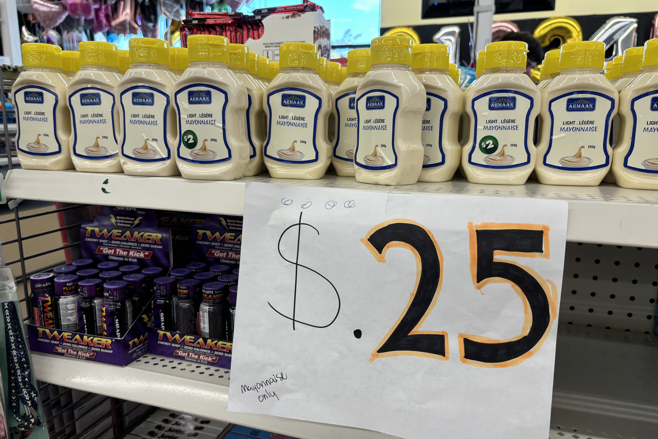A picture of a row of mayonnaise jars priced at 25 cents.