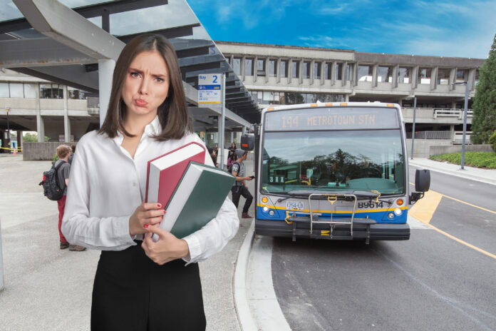 summertime-sadness1 PHOTO: Of a student who looks emotional/overwhelmed standing at the SFU lower bus loop with a bunch of books in hand. We should be able to get the vibe that they really don't want to be on campus during the summer.