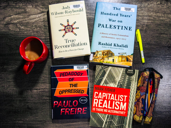 books_emily-le This is a photo of the four books mentioned in the article neatly laid out on a table