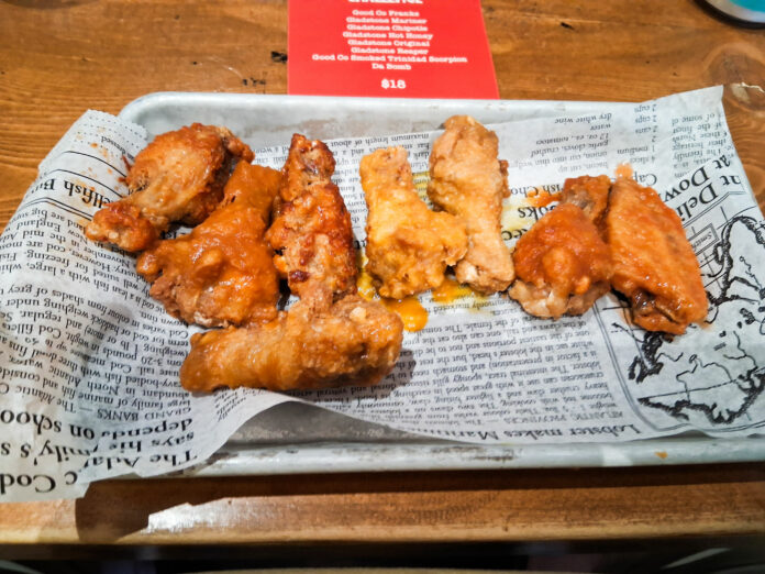 the wings and the menu of the hot sauce coating