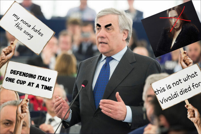 picture of the Italian Foreign Minister and edited protest signs behind him saying "my nona hates this song," "this is not what Vivaldi died for," "defending Italy one cup at a time."