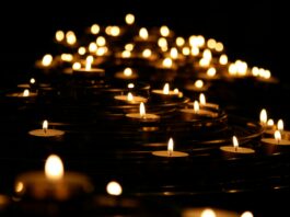 A photo of several lit candles