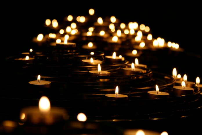 A photo of several lit candles