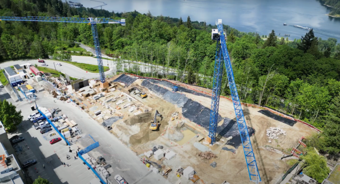 This is a birds eye view photo of the construction in the northern residence parking lot on a bright sunny day.