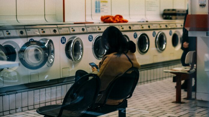 wgog Photo of a person waiting at a laundromat