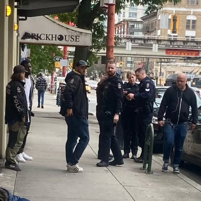 This is a photo of several police officers gathered together in a group in Vancouver’s Chinatown.