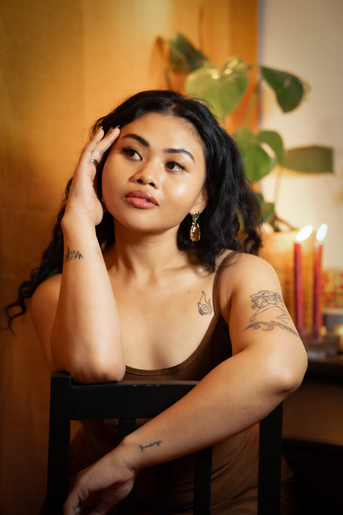 This is a sourced photo of a TV in static against a yellow background