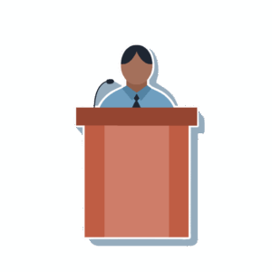 This is an illustration of a figure with short black hair, a blue shirt, and a black tie standing behind a podium that has a microphone.