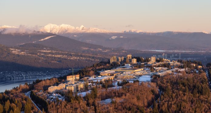 A bird’s-eye view of Burnaby Mountain, where you can see the SFU Burnaby campus, is pictured during sunset.