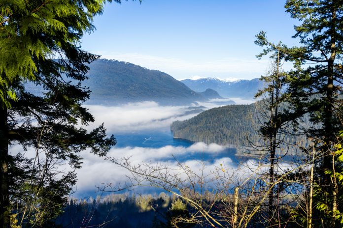 a photo of the Burrard Inlet that shows the mountainous landscape.